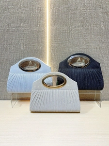 Elegant pleated evening clutch bags in blue, silver and black with oval metal handles