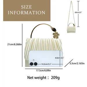 Size guide for ivory pleated satin clutch bag with dimensions and gold ring handle details