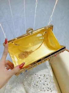 Luxurious gold evening clutch bag with colorful crystals and rhinestone ring clasp