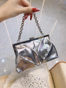 Silver metallic clutch bag featuring geometric pleated texture and thick chain handle