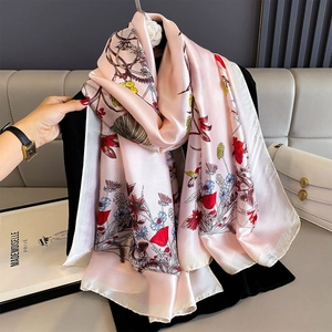 Pink silk-like floral scarf with vibrant flower and bird prints for summer fashion