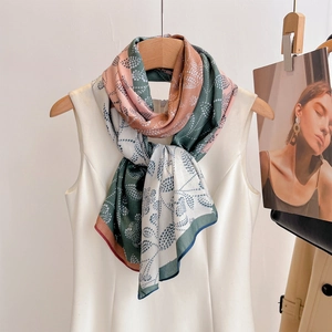 Elegant dual-tone floral beach scarf with botanical print tied on a summer white dress