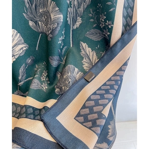 Luxurious dark green beach shawl featuring vintage floral prints and herringbone weave