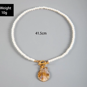 Detail of shell pendant pearl necklace with toggle clasp, 41.5cm length and 10g weight