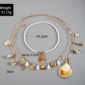 Detail showing tiered bohemian shell and starfish pendant necklace with length measurements
