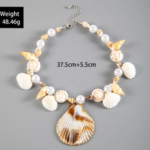 Detail view of Bohemian shell and pearl necklace showing size and weight specifications