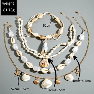 Detailed view of layered bohemian necklace with shell and starfish charms and measurements