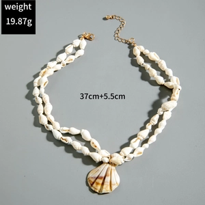 Detail of bohemian shell necklace showing lobster clasp and adjustable extension chain