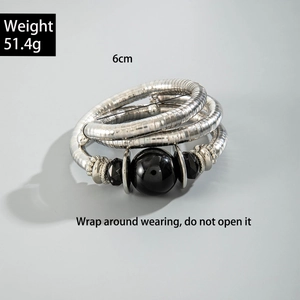 Detail of silver snake-shaped wrap bracelet with black beads and 51.4g weight info