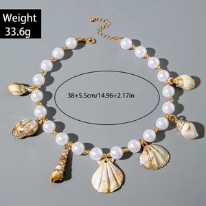 Detail showing shell starfish charms and pearls on bohemian style necklace with measurements