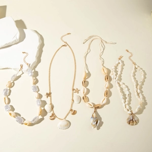 Bohemian seashell and starfish pendant necklaces set with gold chains and pearls