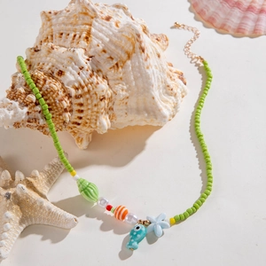 Green beaded ocean necklace with starfish, fish charms and pearls for beach vacation