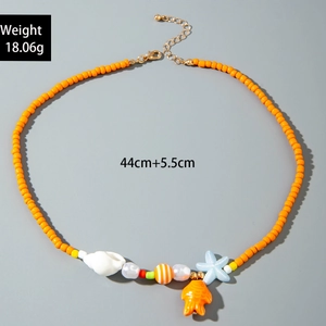 Detail view of colorful ocean-themed beaded necklace with starfish and shell pendants