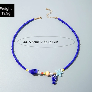 Detail of beaded ocean-themed necklace with shell pendants and blue starfish charms