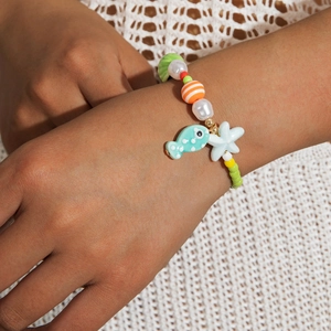 Detail of colorful beaded necklace with starfish and fish charms for a beach holiday
