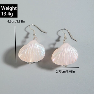 Detail of pink pearlescent shell earrings with size 1.81in and weight 13.4g markers