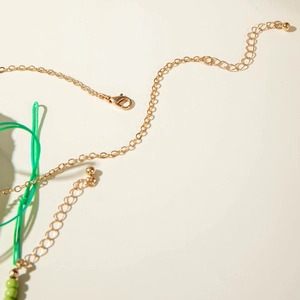 Detailed macro view of the gold lobster clasp and extension chain on starfish necklace