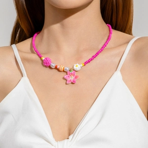 Colorful beaded necklace featuring a pink flower pendant and daisy resin charms for women