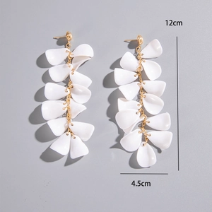 Detail view of long tassel shell earrings with dimensions 12cm length and 4.5cm width