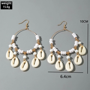 Detail view of beach style shell hoop earrings with dimensions 10cm by 6.4cm