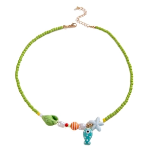 Starfish shell beaded necklace with green beads and ocean-themed ceramic pendants
