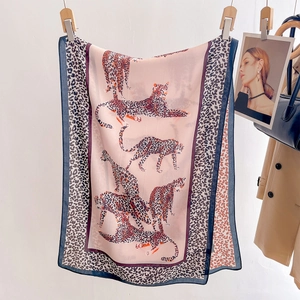 Elegant lightweight leopard print silk scarf for women displayed with fashion accessories