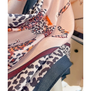 Elegant leopard print silk scarf in pale pink with chevron weave and patchwork design