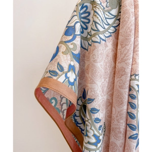 Luxurious paisley print shawl for women featuring vintage floral patterns and silk texture