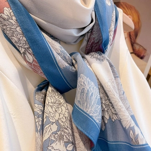 Blue and white floral silk scarf with elegant botanical patterns and deep blue border