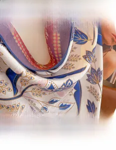 Detail of cotton linen scarf showing delicate floral patterns and woven texture