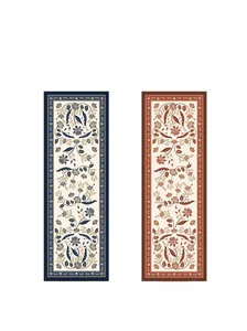 Detailed view of the double-sided floral vine pattern and contrasting colors of the scarf