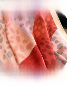 Macro view of multi-color spotted pattern scarf with twill weave and soft cotton-linen feel