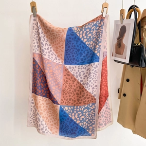 Elegant geometric leopard print silk scarf for women in navy and orange tones