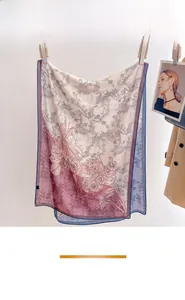 Detailed view of plant flower print on semi-transparent linen scarf with premium texture