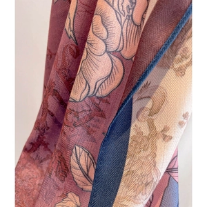 Elegant floral print cotton linen scarf with deep red patterns and herringbone weave texture