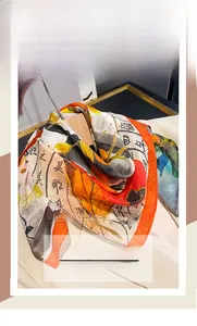 Détail d'un foulard en soie et coton avec calligraphie chinoise et bordure orange vive
