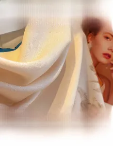Macro detail of breathable herringbone weave fabric on beige scarf with soft texture