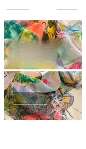 Detail of floral silk scarf showing fine edge stitching and vibrant oil painting print