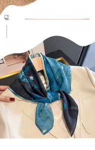 Silk neckerchief with blue ink pattern styled on an ivory suit blazer collar