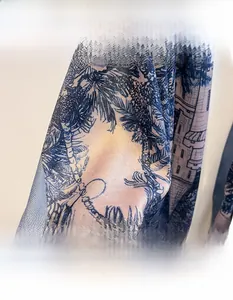 Close-up of printed scarf featuring vintage palm trees and architecture with cotton-linen feel