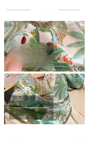 Macro shot of tropical leaf print silk blend scarf showing delicate stitching and texture