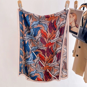 Elegant rectangular scarf with colorful botanical leaf prints for stylish beach protection