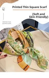 Detail of a soft printed square scarf with green leaves on a beige blazer