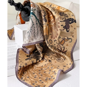 Artistic double-sided silk square scarf featuring deer and leopard prints in golden brown