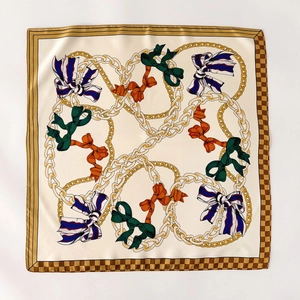 Elegant 2025 square silk scarf with golden chain patterns and colorful bow details