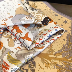 Detail of silk twill scarf showing high-end floral and wildlife print textures