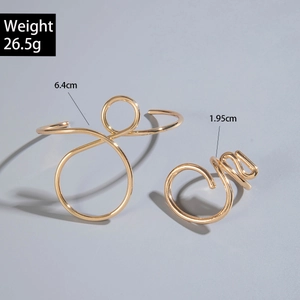 Detailed view of minimalist gold open bangle and ring set with precise size measurements