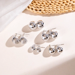 Five-piece silver geometric earring set with polished finish and irregular metal shapes