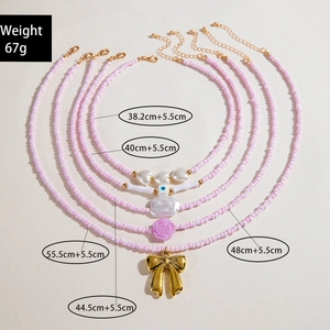 Detailed size specifications for a set of 5 pink beaded and pearl layered necklaces