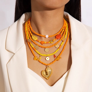 Bohemian multilayer beaded necklace set with orange beads and golden heart pendant